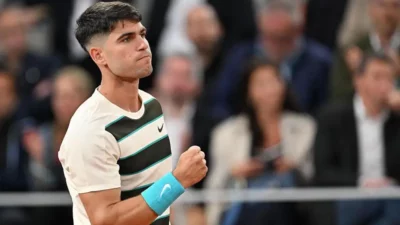 Alcaraz overcomes blip to progress to round three